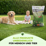 Ein Golden Retriever, ein Baby und eine große Tüte TerraUno Saisonstart-Rasenset sitzen auf grünem Gras. Der Text darunter lautet: Alle Produkte unbedenklich für Mensch und Tier.